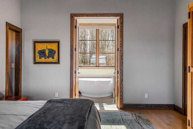 10258 Burgoyne Rd, Berrien Springs, MI 49103 - bedroom featuring baseboards and wood finished floors
