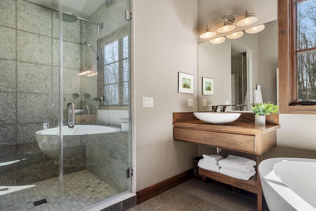 10258 Burgoyne Rd, Berrien Springs, MI 49103 - full bathroom featuring a freestanding bath, baseboards, vanity, a shower stall, and tile patterned floors