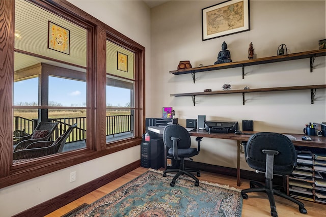 10258 Burgoyne Rd, Berrien Springs, MI 49103 - office area featuring light wood-style flooring and baseboards