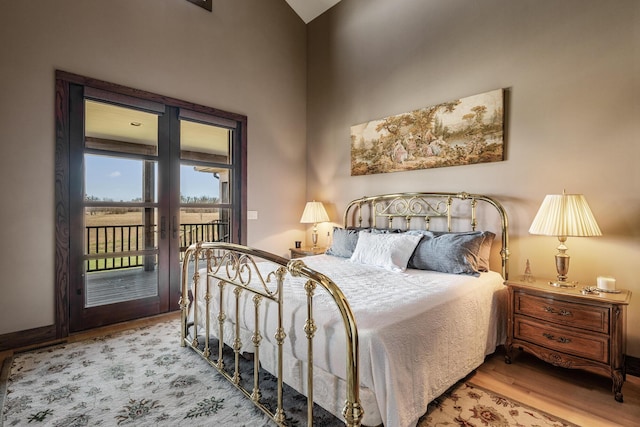 10258 Burgoyne Rd, Berrien Springs, MI 49103 - bedroom featuring access to exterior and wood finished floors