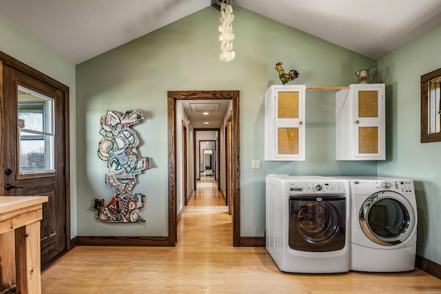 10258 Burgoyne Rd, Berrien Springs, MI 49103 - laundry area with washer and clothes dryer, light wood-type flooring, and baseboards