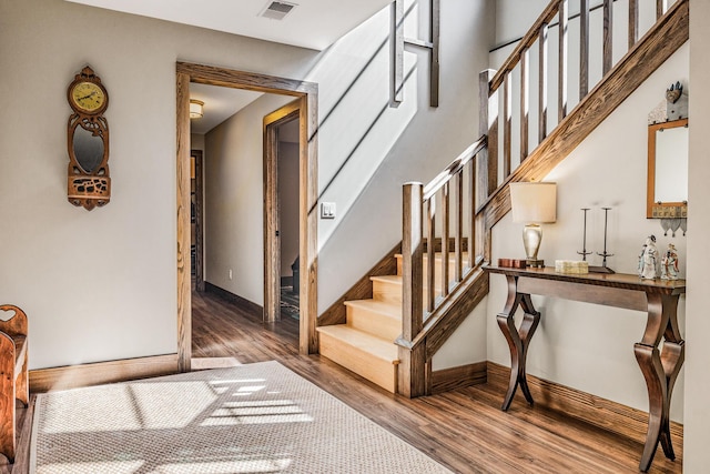 10258 Burgoyne Rd, Berrien Springs, MI 49103 - stairway featuring wood finished floors and baseboards