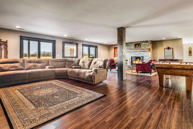10258 Burgoyne Rd, Berrien Springs, MI 49103 - living area with billiards, dark wood finished floors, a stone fireplace, plenty of natural light, and recessed lighting