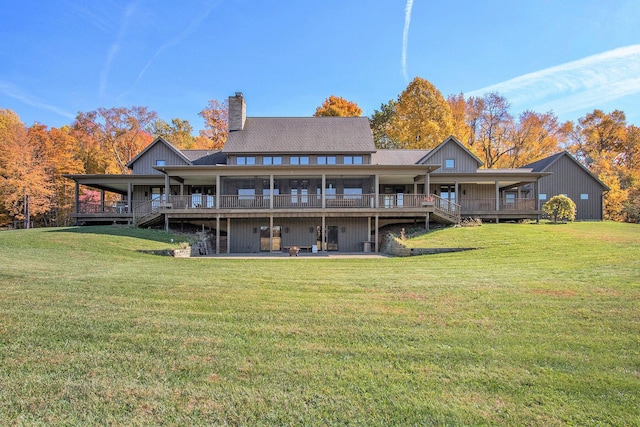 10258 Burgoyne Rd, Berrien Springs, MI 49103 - rear view of house featuring a chimney, a wooden deck, a yard, and stairway