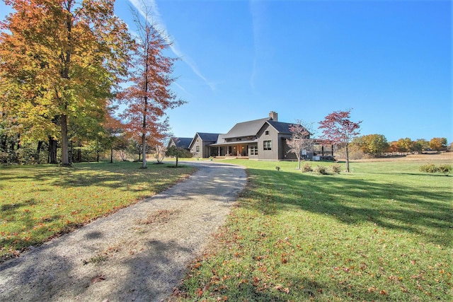 10258 Burgoyne Rd, Berrien Springs, MI 49103 - view of front facade featuring a front lawn and a chimney