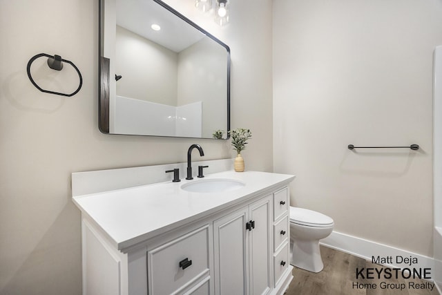 11012 Riverview Dr, Big Rapids, MI 49307 - bathroom featuring vanity, wood finished floors, a bathtub, and a shower