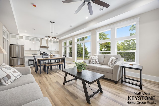 11012 Riverview Dr, Big Rapids, MI 49307 - living area with healthy amount of natural light, recessed lighting, light wood-type flooring, and ceiling fan