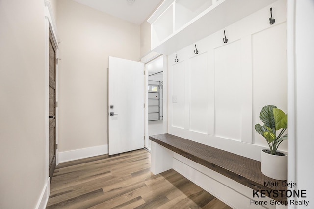 11012 Riverview Dr, Big Rapids, MI 49307 - mudroom with wood finished floors and baseboards