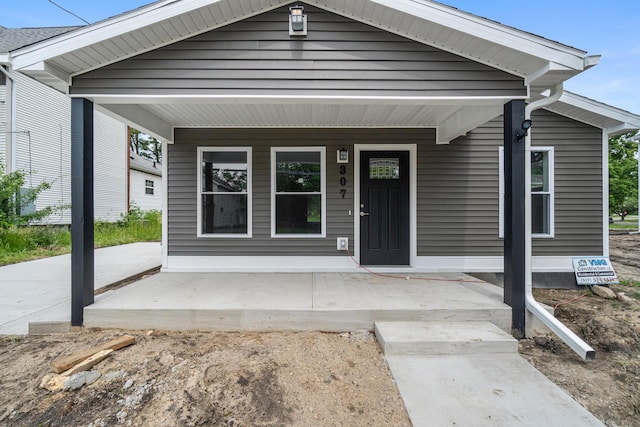 307 N Perrine St, Jackson, MI 49201 - view of exterior entry with a porch