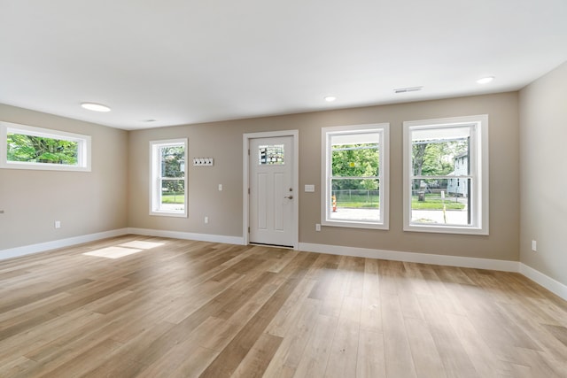 307 N Perrine St, Jackson, MI 49201 - entrance foyer featuring baseboards and light wood finished floors