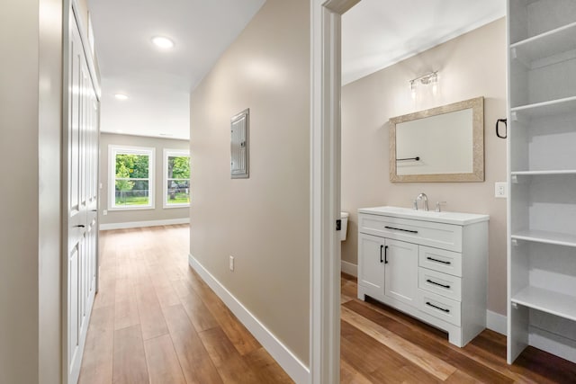 307 N Perrine St, Jackson, MI 49201 - hall with light wood-style floors, electric panel, and recessed lighting