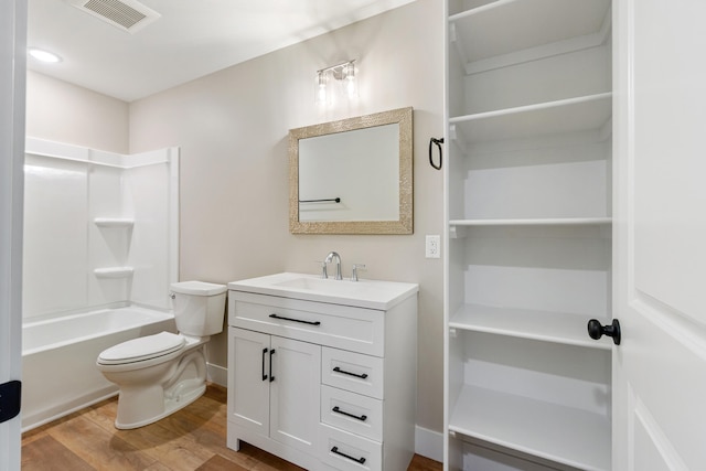 307 N Perrine St, Jackson, MI 49201 - full bath with vanity, wood finished floors, and shower / tub combination