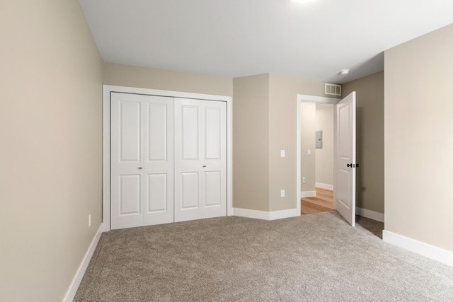 307 N Perrine St, Jackson, MI 49201 - unfurnished bedroom with carpet floors and a closet