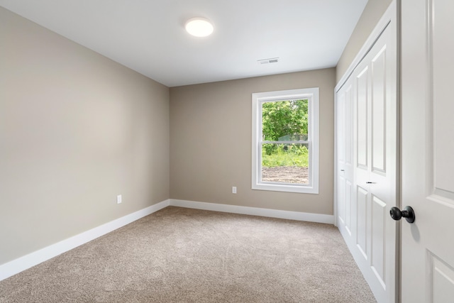 307 N Perrine St, Jackson, MI 49201 - unfurnished bedroom with carpet and a closet