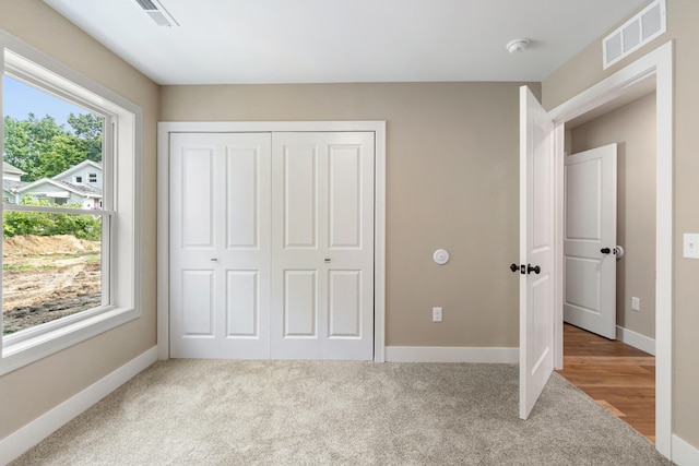 307 N Perrine St, Jackson, MI 49201 - unfurnished bedroom featuring carpet floors and a closet
