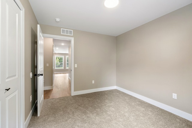 307 N Perrine St, Jackson, MI 49201 - spare room featuring carpet flooring and a smoke detector