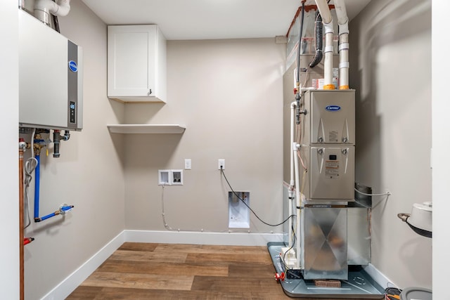307 N Perrine St, Jackson, MI 49201 - utility room with tankless water heater