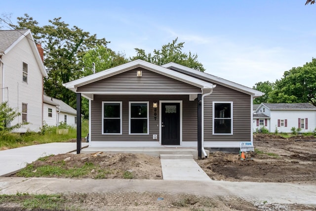 307 N Perrine St, Jackson, MI 49201 - view of front of home featuring covered porch