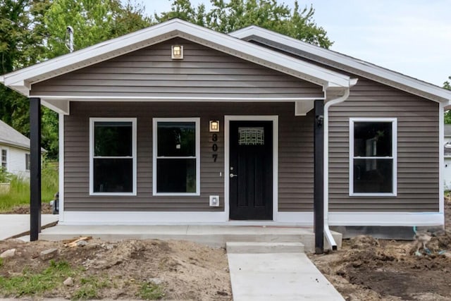 307 N Perrine St, Jackson, MI 49201 - view of front of property with covered porch