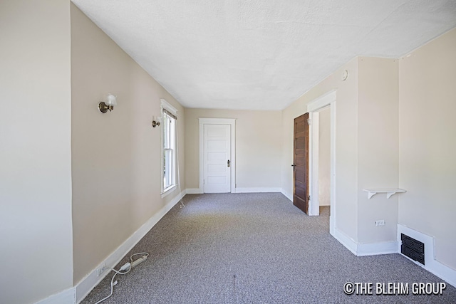 200 Richards Ave NW, Grand Rapids, MI 49504 - carpeted spare room with baseboards and a smoke detector