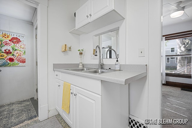 200 Richards Ave NW, Grand Rapids, MI 49504 - kitchen featuring white cabinets, light countertops, and light carpet