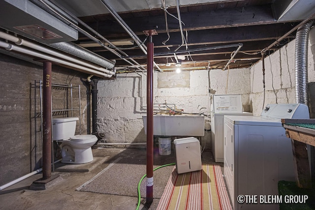 200 Richards Ave NW, Grand Rapids, MI 49504 - unfinished basement featuring separate washer and dryer and a sink