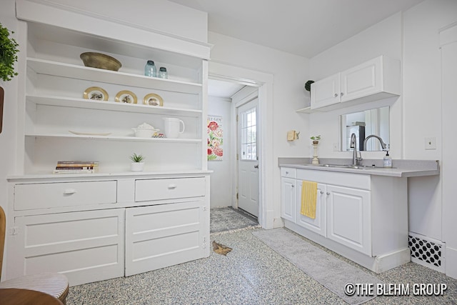 200 Richards Ave NW, Grand Rapids, MI 49504 - kitchen featuring open shelves, light countertops, and white cabinets