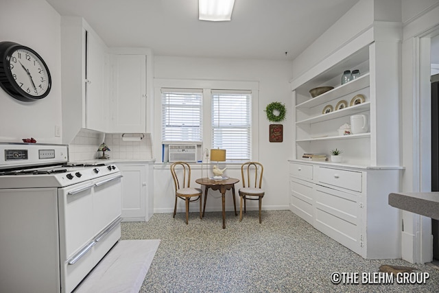 200 Richards Ave NW, Grand Rapids, MI 49504 - kitchen with white range, white cabinetry, open shelves, tasteful backsplash, and cooling unit