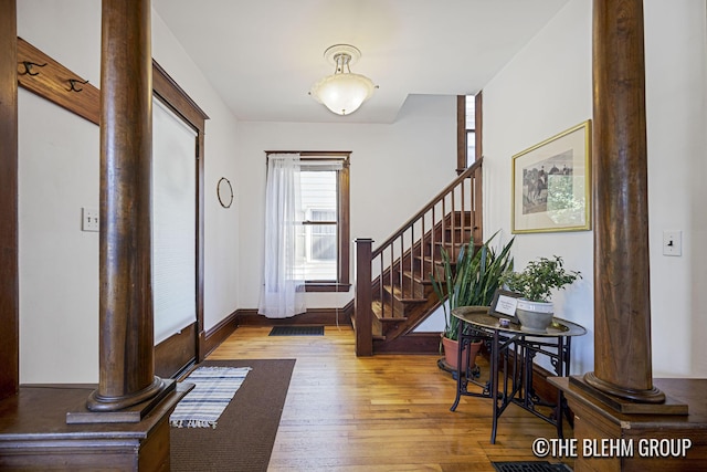 200 Richards Ave NW, Grand Rapids, MI 49504 - foyer entrance featuring decorative columns, hardwood / wood-style floors, and stairway