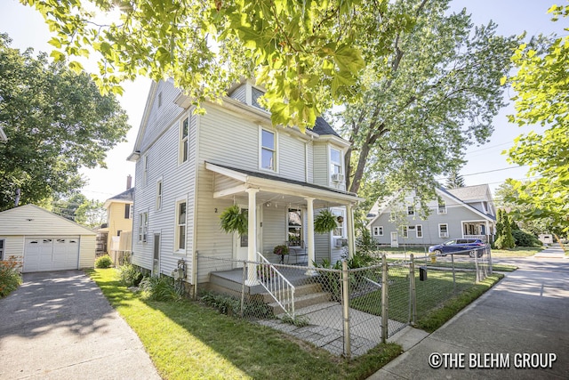 200 Richards Ave NW, Grand Rapids, MI 49504 - traditional style home with an outdoor structure, a detached garage, concrete driveway, and a porch