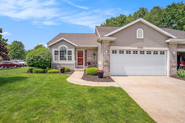 15532 Winchester Cir, Grand Haven, MI 49417 - ranch-style house featuring roof with shingles, driveway, a front lawn, and an attached garage