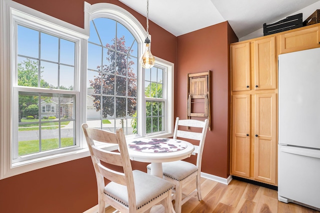 15532 Winchester Cir, Grand Haven, MI 49417 - dining area with light wood-style flooring and baseboards