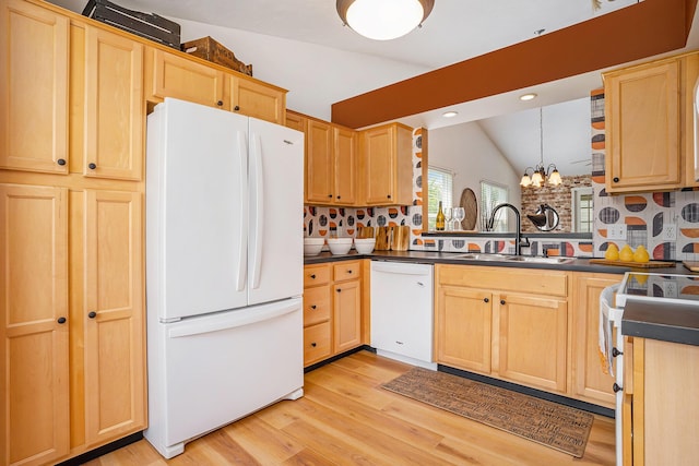 15532 Winchester Cir, Grand Haven, MI 49417 - kitchen featuring white appliances, lofted ceiling, light brown cabinets, dark countertops, and recessed lighting