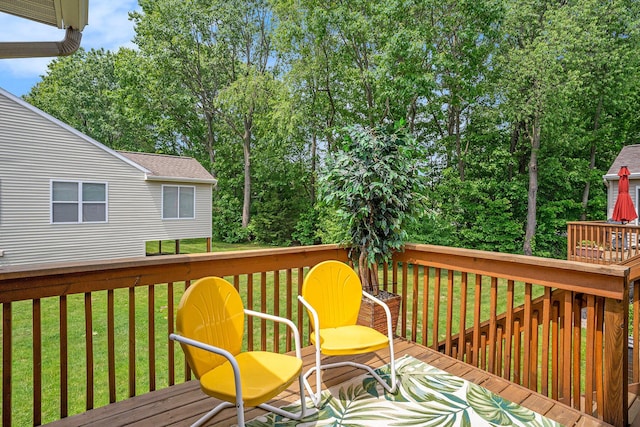 15532 Winchester Cir, Grand Haven, MI 49417 - wooden deck featuring a lawn and view of scattered trees