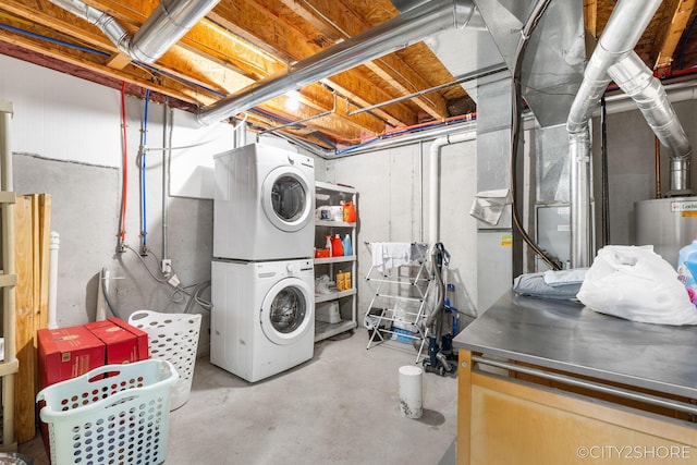 2883 Harmony Ct, Wyoming, MI 49519 - unfinished below grade area featuring stacked washer and clothes dryer and electric water heater