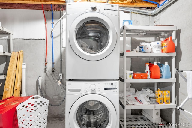 2883 Harmony Ct, Wyoming, MI 49519 - washroom featuring stacked washer / drying machine