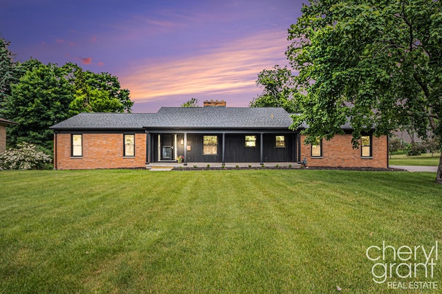 1757 Westlane Dr NE, Grand Rapids, MI 49505 - single story home featuring a front yard, brick siding, and a chimney