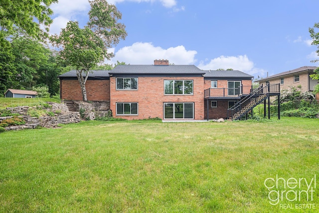 1757 Westlane Dr NE, Grand Rapids, MI 49505 - back of house featuring stairs, a chimney, brick siding, a deck, and a yard