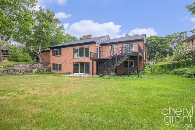 1757 Westlane Dr NE, Grand Rapids, MI 49505 - back of house featuring stairway, a deck, brick siding, and a yard