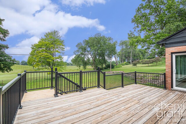 1757 Westlane Dr NE, Grand Rapids, MI 49505 - wooden deck featuring a yard
