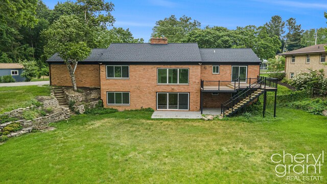1757 Westlane Dr NE, Grand Rapids, MI 49505 - rear view of property with stairs, a chimney, and a yard