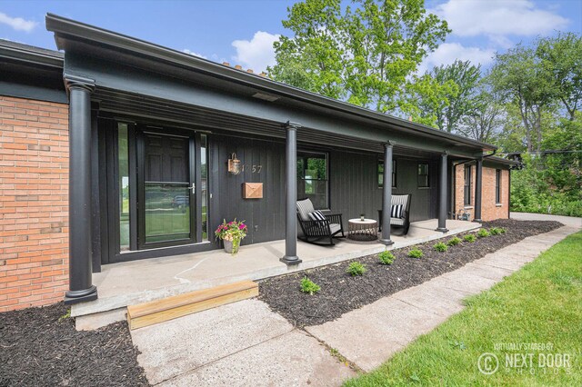 1757 Westlane Dr NE, Grand Rapids, MI 49505 - entrance to property featuring a porch and brick siding
