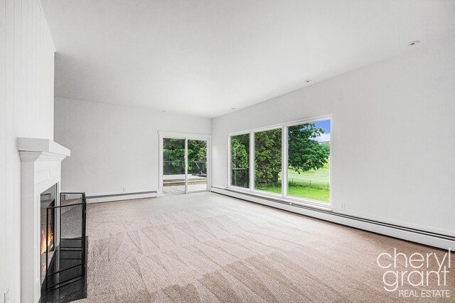 1757 Westlane Dr NE, Grand Rapids, MI 49505 - unfurnished living room featuring a baseboard radiator, carpet, and a warm lit fireplace