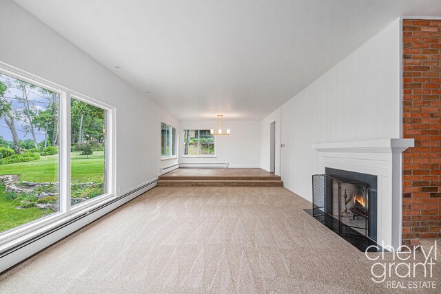 1757 Westlane Dr NE, Grand Rapids, MI 49505 - unfurnished living room with a baseboard heating unit, carpet floors, a fireplace with flush hearth, a chandelier, and a baseboard radiator