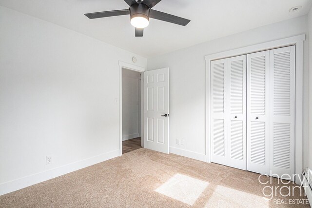1757 Westlane Dr NE, Grand Rapids, MI 49505 - unfurnished bedroom featuring carpet flooring, a closet, and a ceiling fan