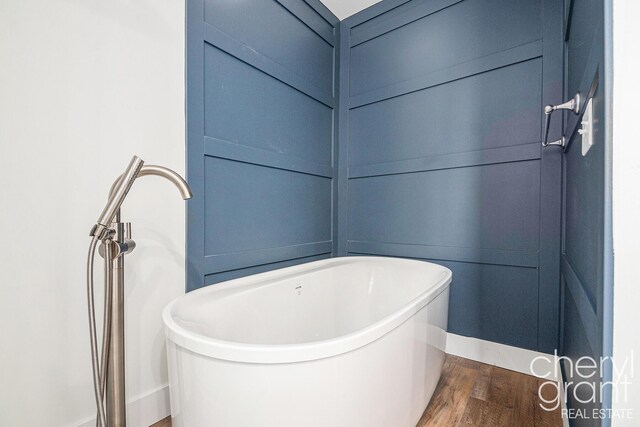 1757 Westlane Dr NE, Grand Rapids, MI 49505 - full bath featuring wood finished floors and a freestanding bath