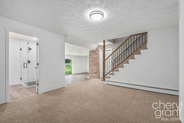 1757 Westlane Dr NE, Grand Rapids, MI 49505 - unfurnished living room with a baseboard heating unit, carpet, baseboard heating, a textured ceiling, and stairs
