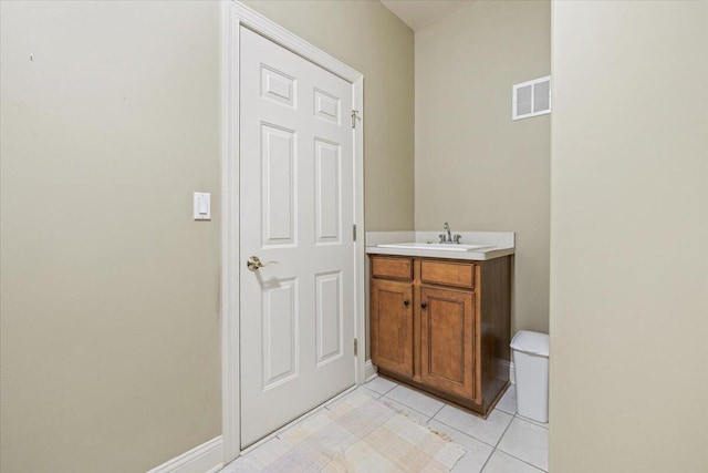 3667 Bay Harbor Dr, Brighton, MI 48114 - half bathroom with vanity and tile patterned flooring