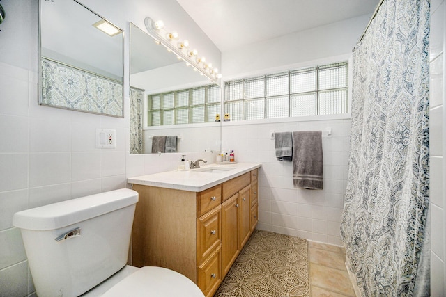 55 E Lewis Ave, Milan, MI 48160 - bathroom featuring tile walls, toilet, vanity, tile patterned flooring, and curtained shower