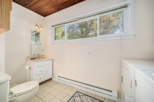 55 E Lewis Ave, Milan, MI 48160 - bathroom with wood ceiling, a baseboard radiator, washer and dryer, vanity, and toilet
